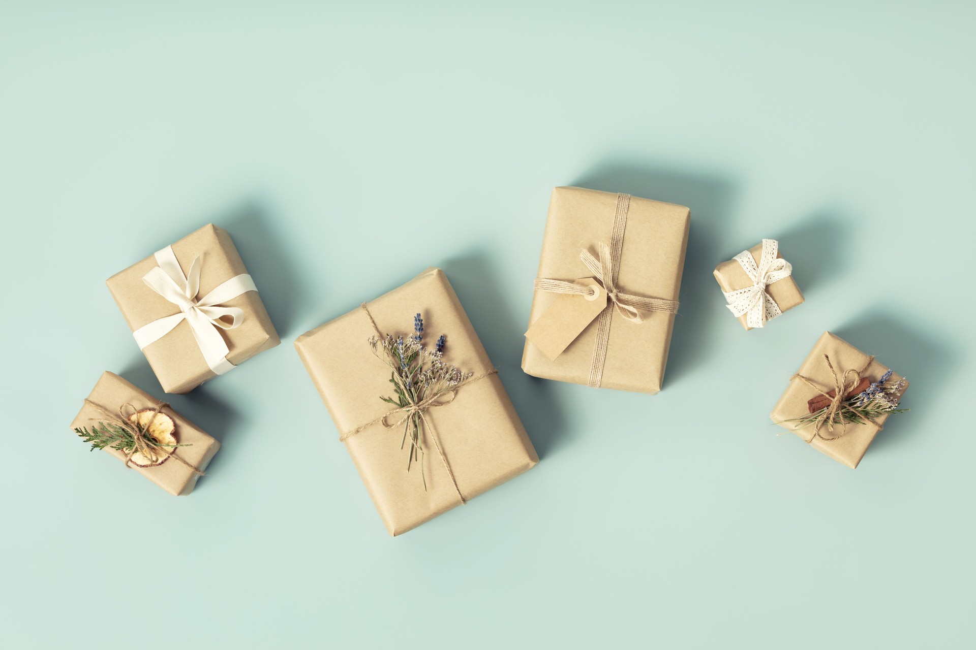 Christmas gift boxes on blue background flat lay